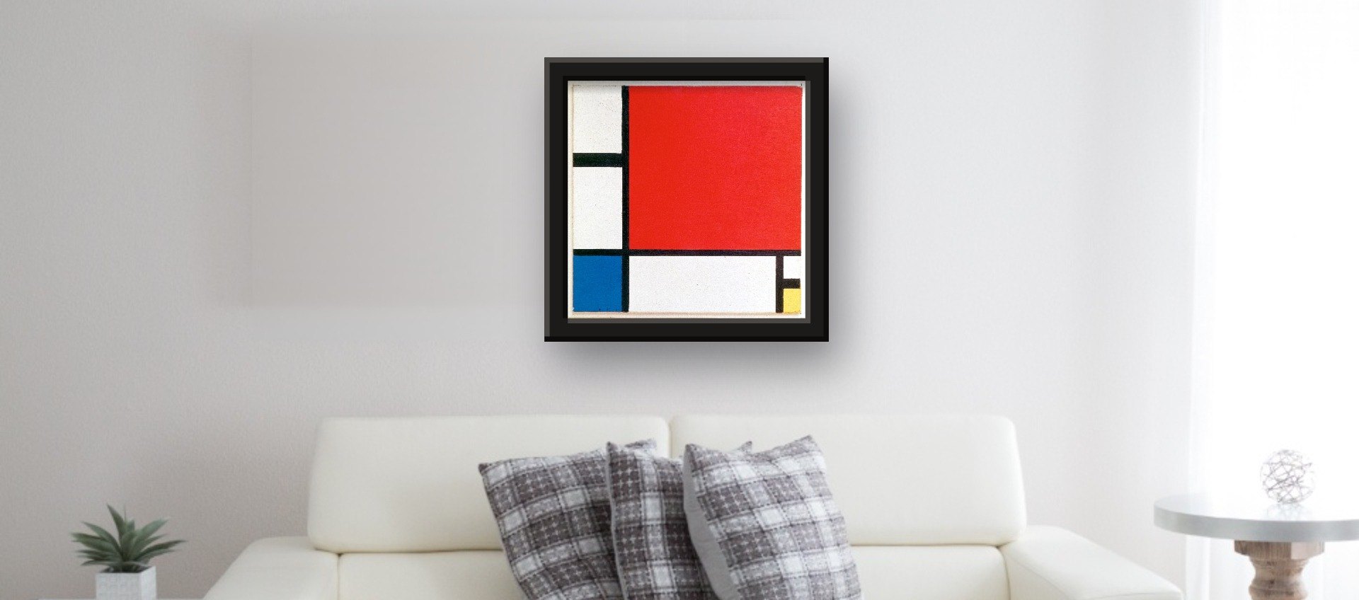 Composition II in Red, Blue, and Yellow by Piet Mondrian · framed art print, 2-inch black wood frame, 20 × 20 in print (51 × 51 cm), framed 24 × 24 in, rendered at true scale above a sofa
